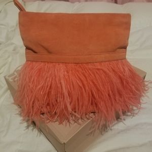 Coral purse with feather in good condition brand new